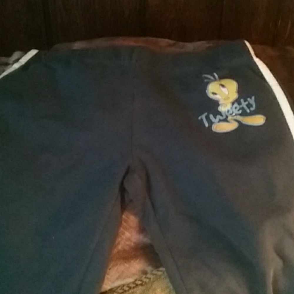 Blue pants with tweety bird, stripes down sides